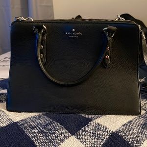 Kate Spade Crossbody purse that has 3 pockets, long strap and small handles